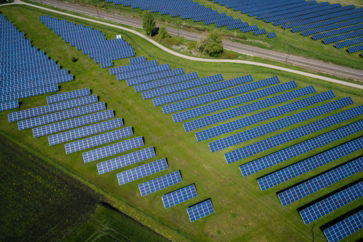 aerial-photography-of-grass-field-with-blue-solar-panels.jpg aerial photography of grass field with blue solar panels